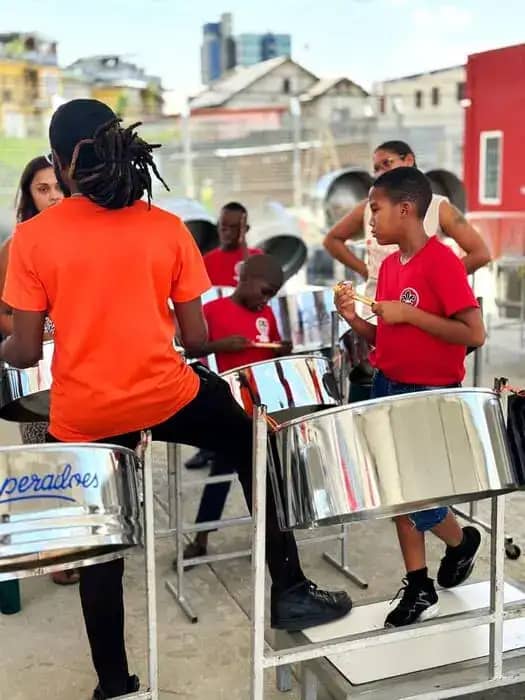 an instructor going through the steelpan rudiments